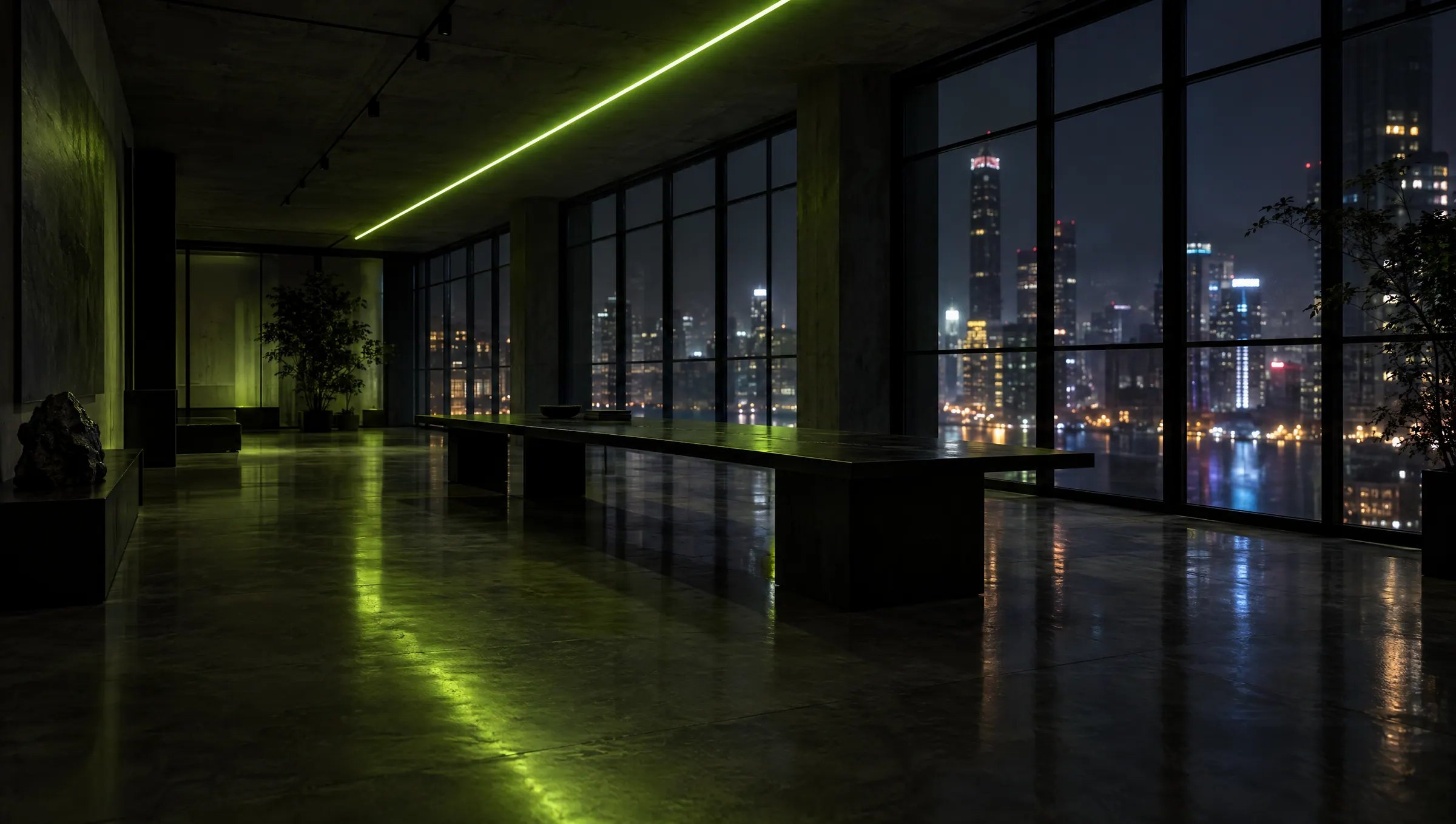 Dark open-plan studio with a lime light line across the ceiling and a city skyline at night